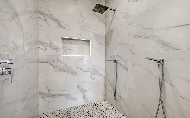 bathroom featuring tiled shower