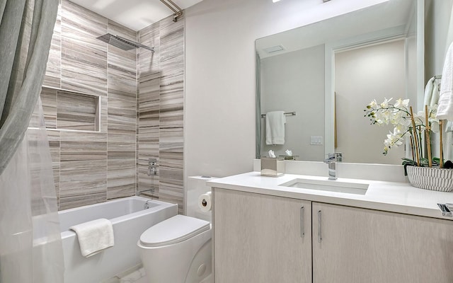 full bathroom featuring shower / tub combo with curtain, vanity, and toilet