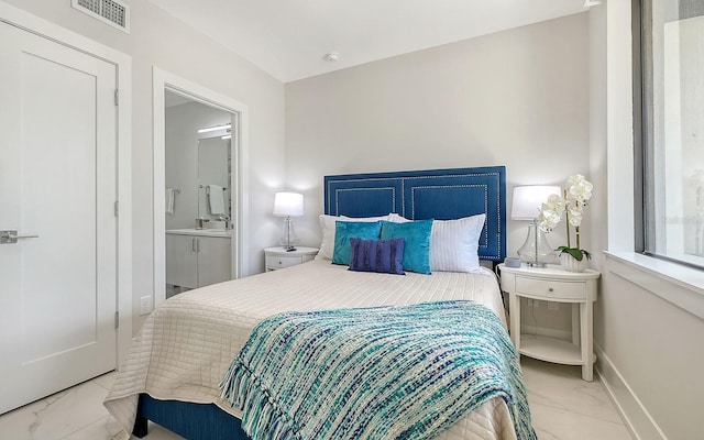 bedroom featuring ensuite bath