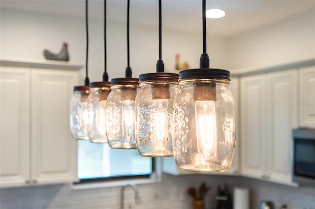 details featuring white cabinetry