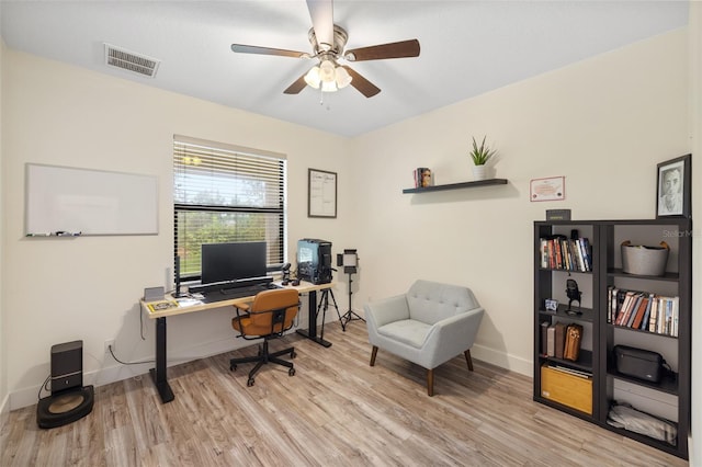 office with ceiling fan and light hardwood / wood-style flooring