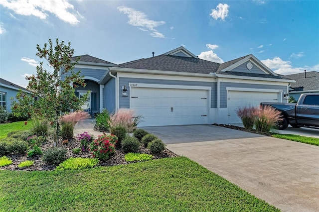 single story home with a garage and a front lawn