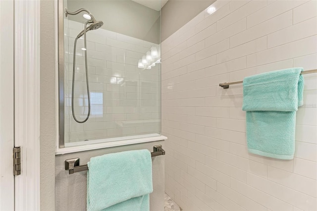 bathroom with tiled shower