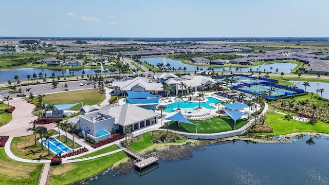 birds eye view of property with a water view