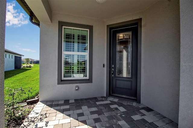 entrance to property with a patio