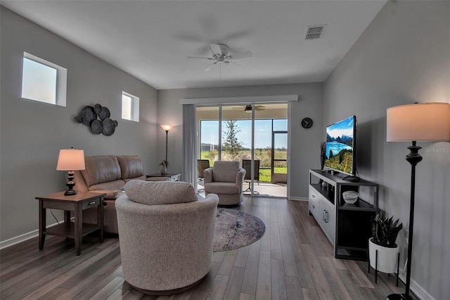 living room with ceiling fan and hardwood / wood-style flooring