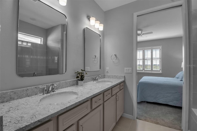 bathroom featuring tile patterned floors, ceiling fan, and vanity