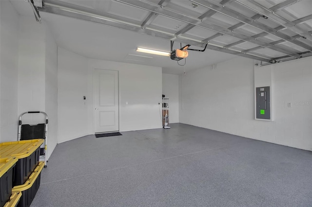 garage with electric panel and a garage door opener