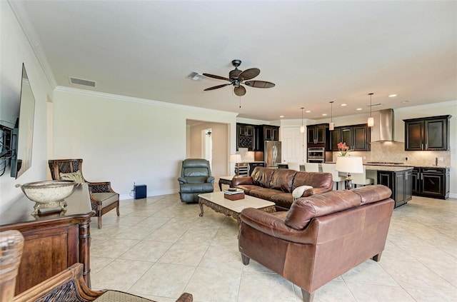 living room featuring ceiling fan, ornamental molding, and light tile patterned flooring