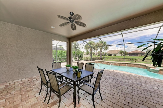 view of patio featuring ceiling fan, a lanai, and pool water feature