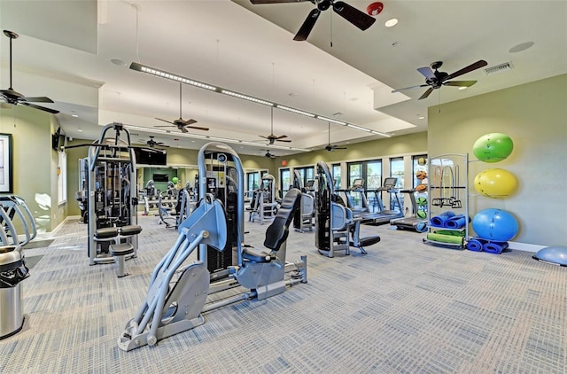 exercise room with light carpet