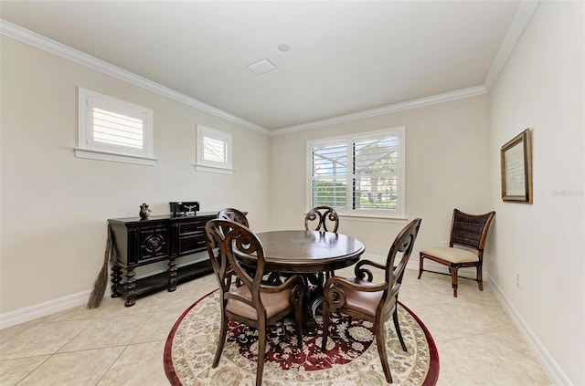 dining area with light tile patterned flooring and ornamental molding