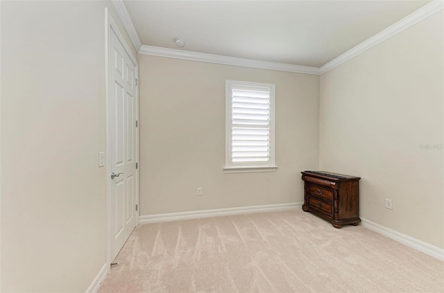 unfurnished bedroom with light colored carpet and ornamental molding