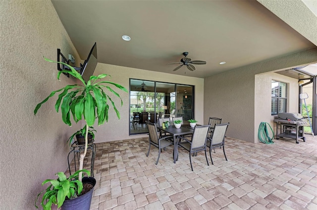 view of patio / terrace with ceiling fan and a grill