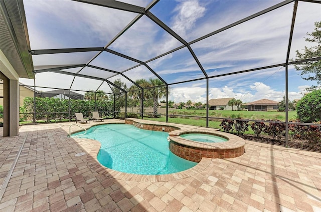 view of swimming pool featuring glass enclosure, an in ground hot tub, and a patio