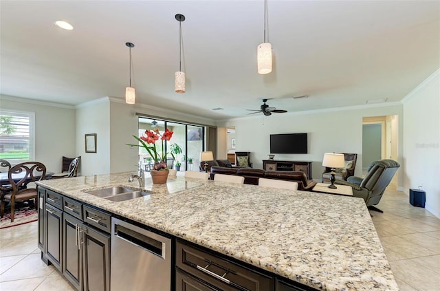 kitchen with dishwasher, sink, hanging light fixtures, ceiling fan, and light stone counters