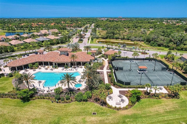 birds eye view of property with a water view