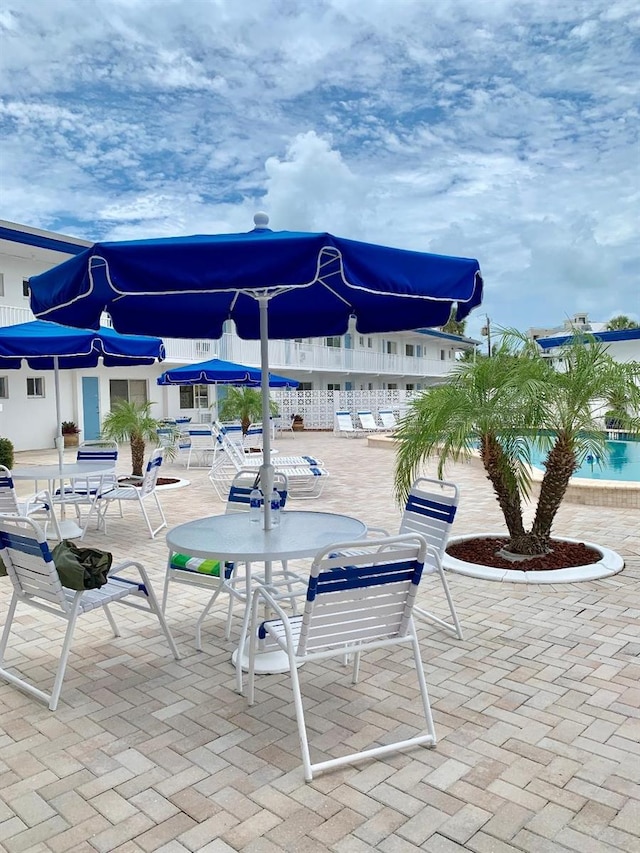 view of patio featuring a community pool