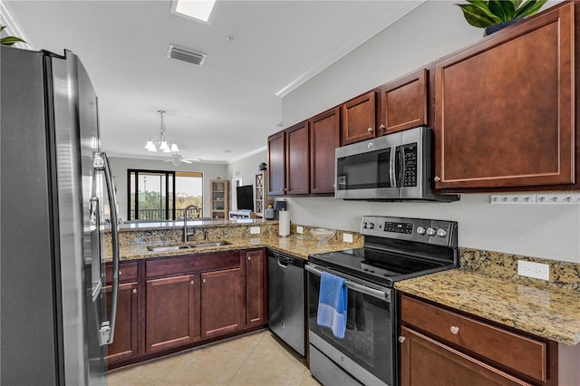 kitchen with sink, light stone counters, kitchen peninsula, appliances with stainless steel finishes, and ornamental molding