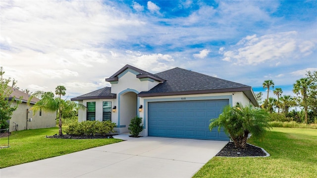 view of front facade featuring a garage and a front lawn