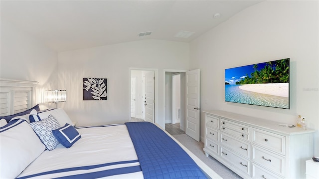 bedroom with light colored carpet and vaulted ceiling