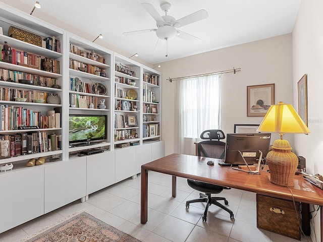 tiled office featuring ceiling fan