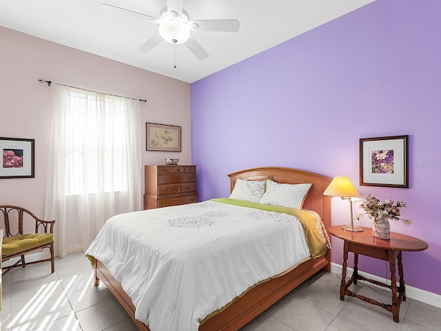 bedroom with ceiling fan and light tile patterned floors