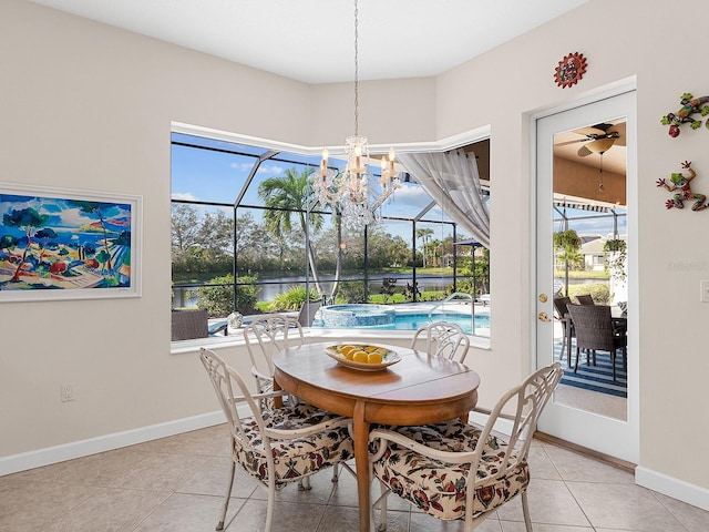 tiled dining area with ceiling fan and a healthy amount of sunlight