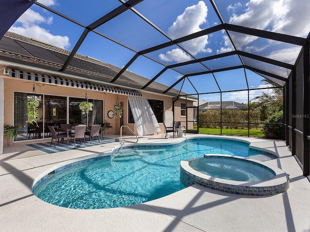 view of pool featuring an in ground hot tub, a lanai, and a patio area