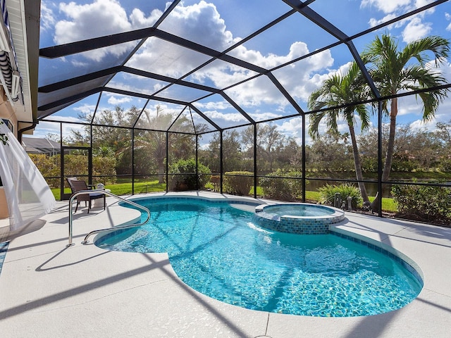 view of swimming pool featuring glass enclosure, an in ground hot tub, and a patio