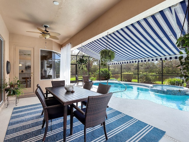 view of swimming pool with an in ground hot tub, ceiling fan, and a patio area