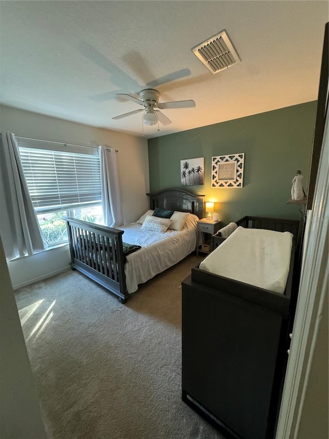 carpeted bedroom featuring ceiling fan