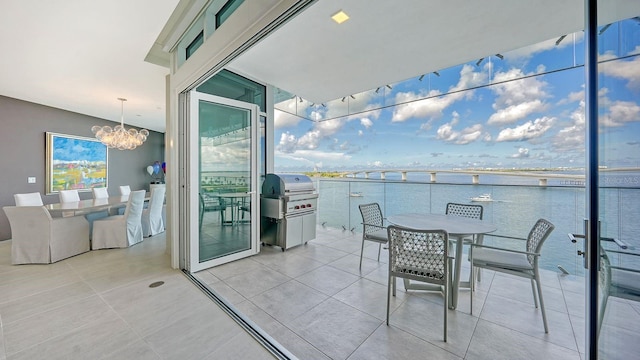 balcony featuring a grill and a water view