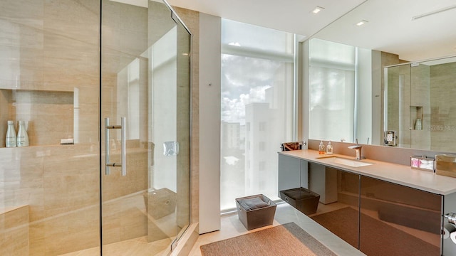 bathroom with vanity, tile patterned floors, and an enclosed shower