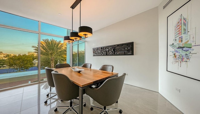 tiled home office featuring floor to ceiling windows