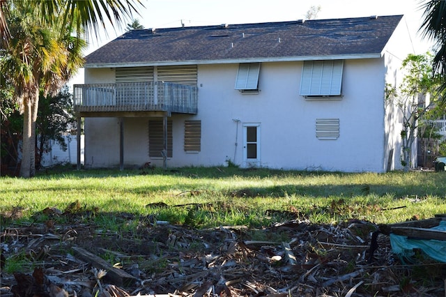 rear view of house with a lawn