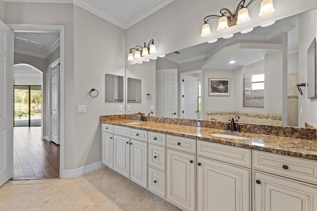 bathroom featuring hardwood / wood-style flooring, vanity, and crown molding