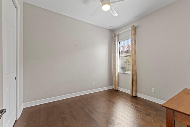 unfurnished bedroom featuring ceiling fan, dark wood-type flooring, and a closet