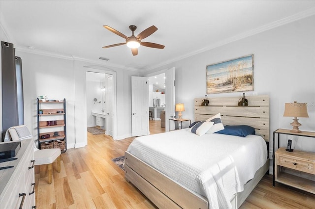 bedroom with ceiling fan, crown molding, ensuite bathroom, and light hardwood / wood-style floors