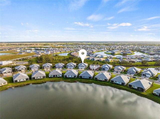 bird's eye view with a water view