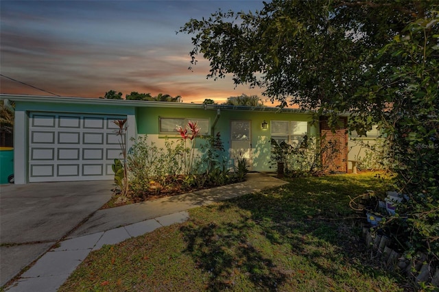 single story home featuring a garage