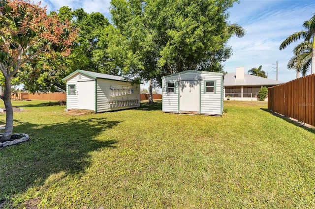 view of yard featuring a storage unit