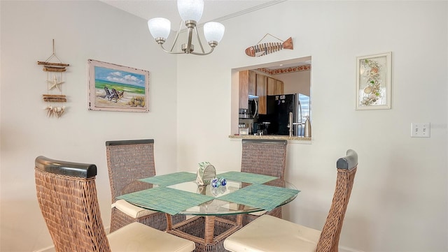 dining room featuring a textured ceiling and a notable chandelier