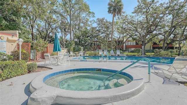 view of pool featuring a hot tub