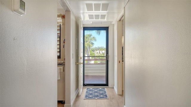 doorway with light wood-type flooring