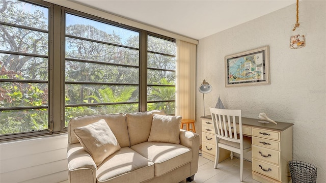 home office with plenty of natural light and light tile patterned floors