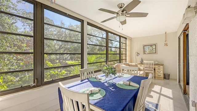 sunroom with ceiling fan and a healthy amount of sunlight