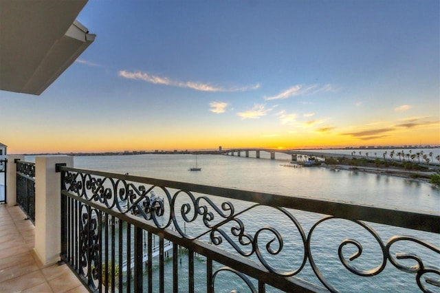 balcony at dusk with a water view