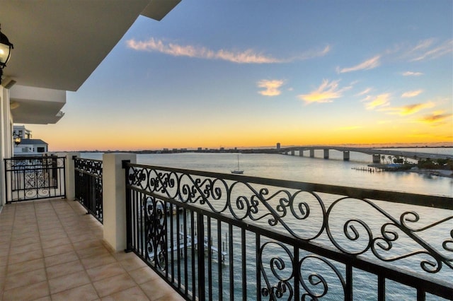 balcony at dusk with a water view