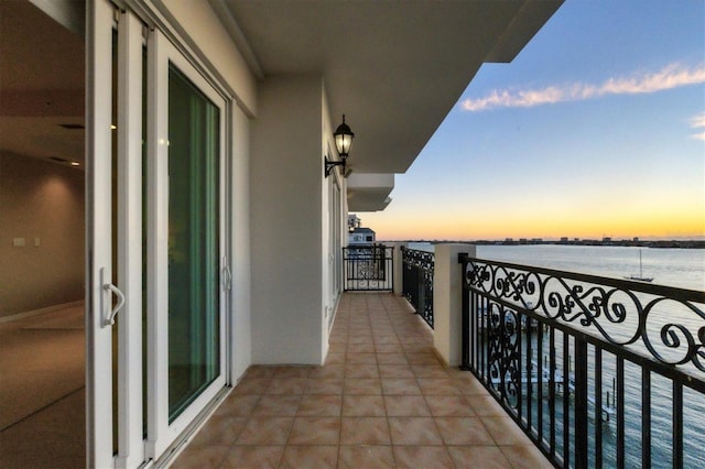 balcony at dusk with a water view